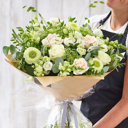 Sympathy hand-tied made with the finest flowers